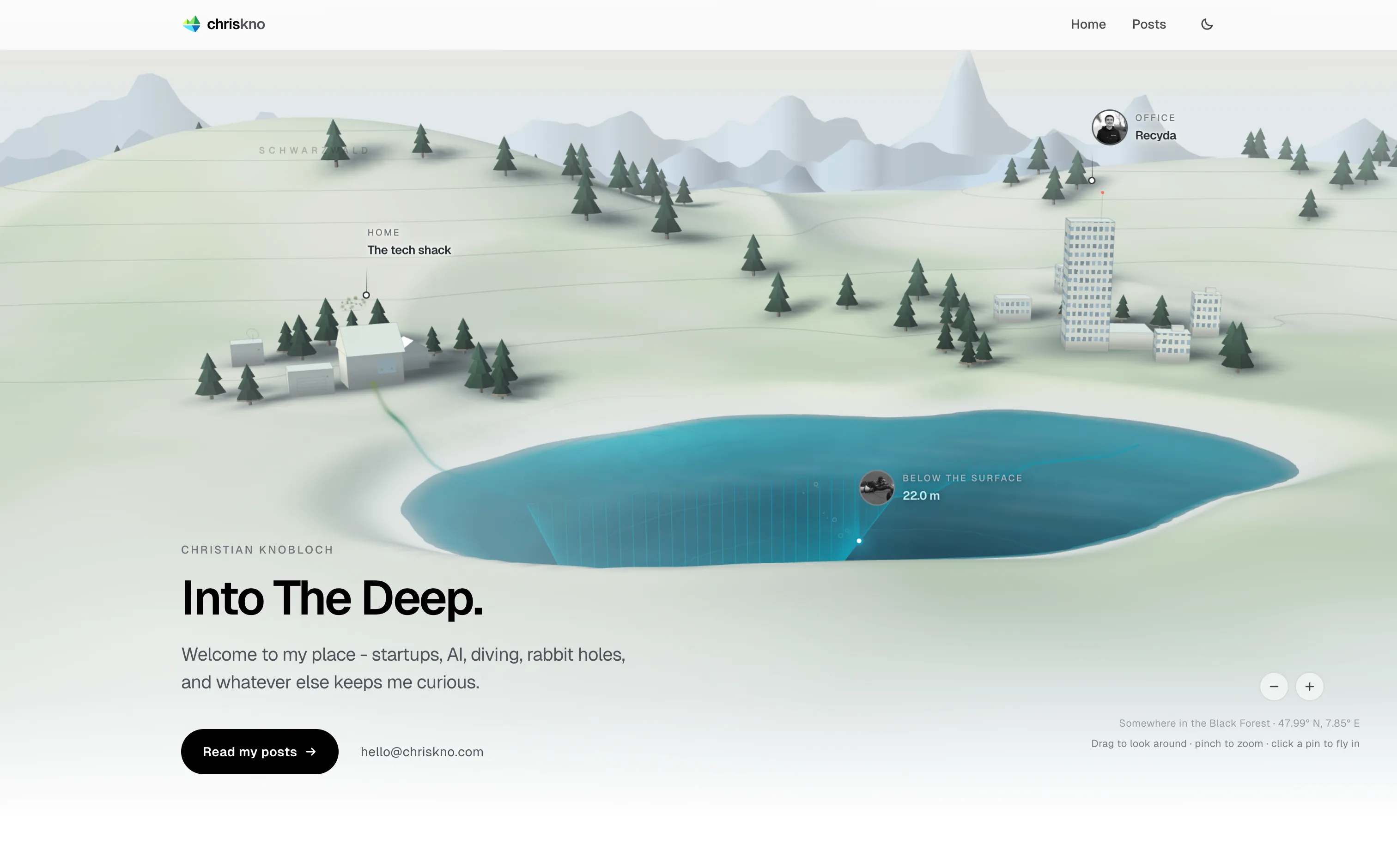The homepage by day: pale stone hills, a turquoise lake, the shack and the office, a diver at 22 metres, under the line Into The Deep.